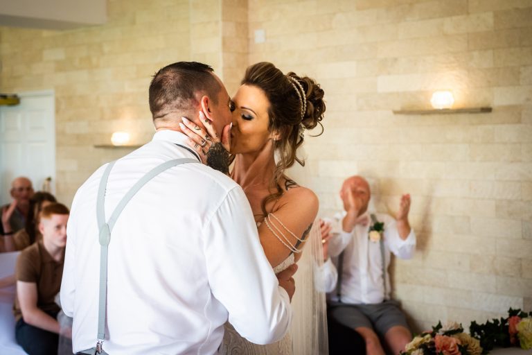 bride and groom kissing at millhouse restaurant captured by hull wedding photographer