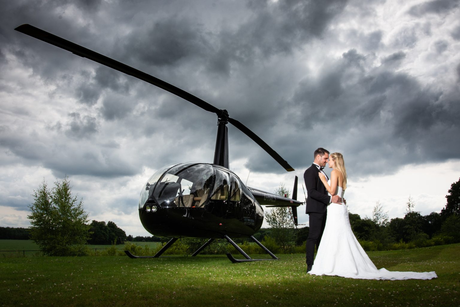 bride and groom are photographed by a helicopter at a luxury hotel