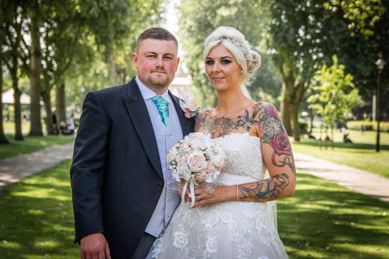 a bride and groom smile after getting married at hull registry office
