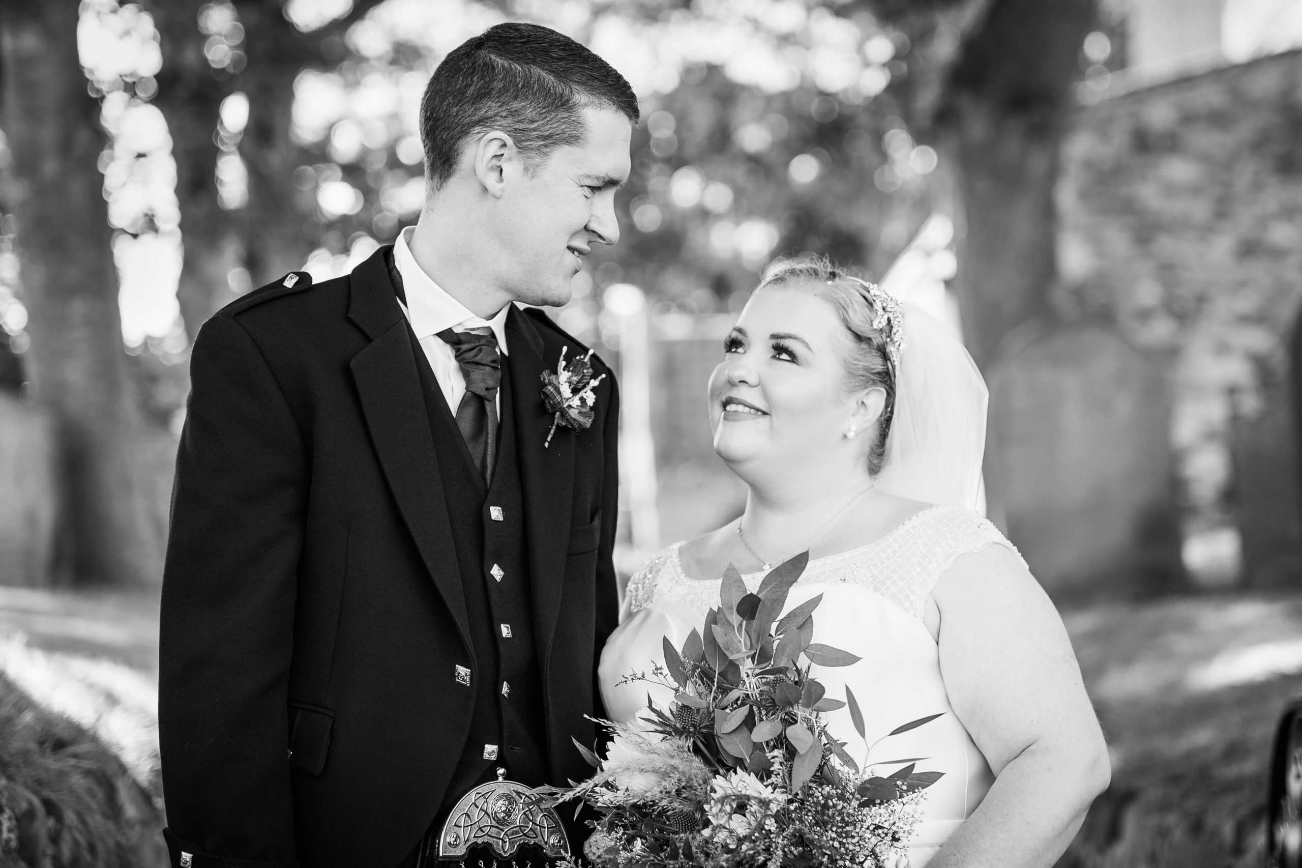 a new wife smiling at her husband captured by tom sutherland hull wedding photographer