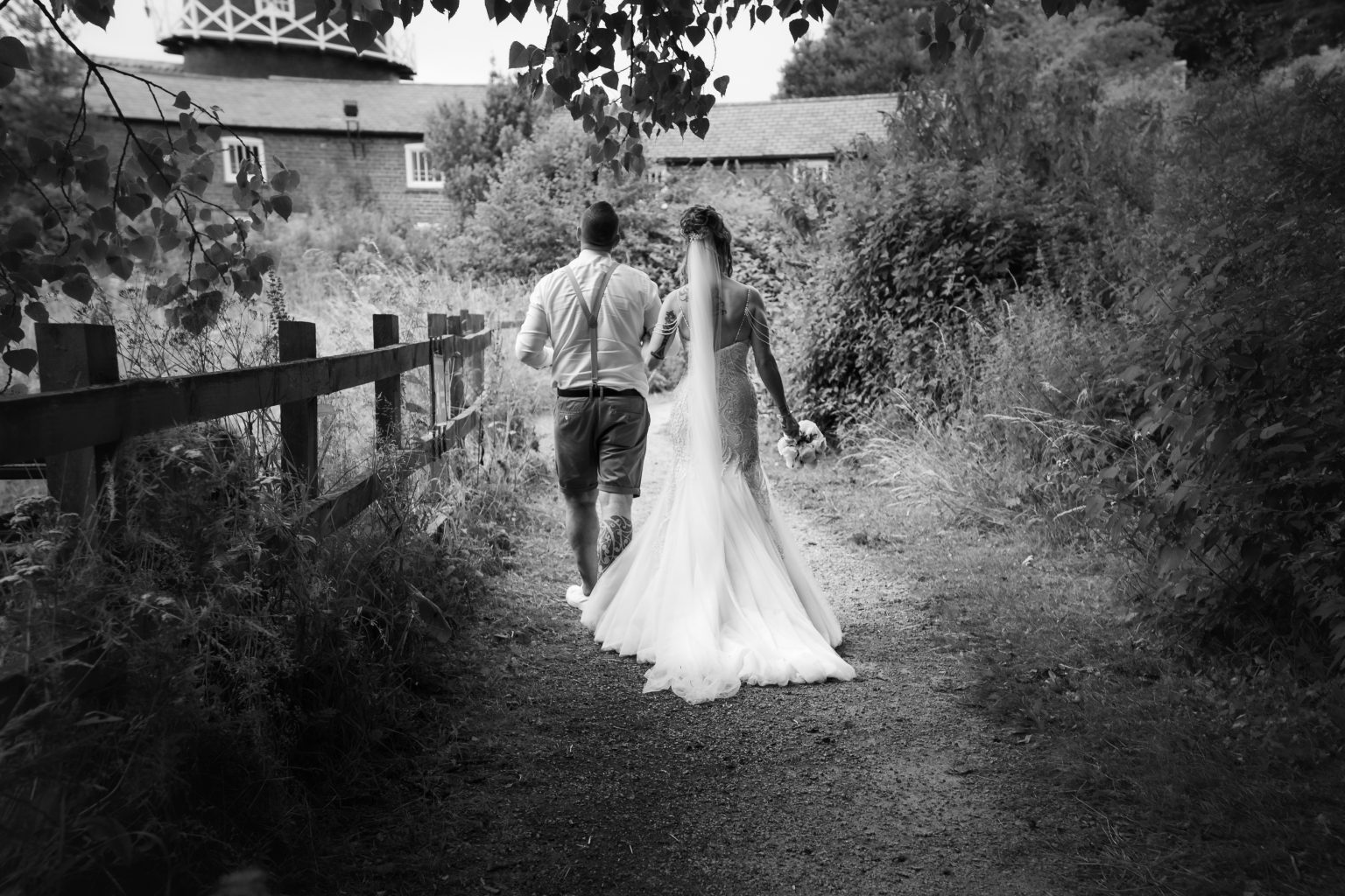 bride and groom spend time with their hull wedding photographer near skidby mill east yorkshire