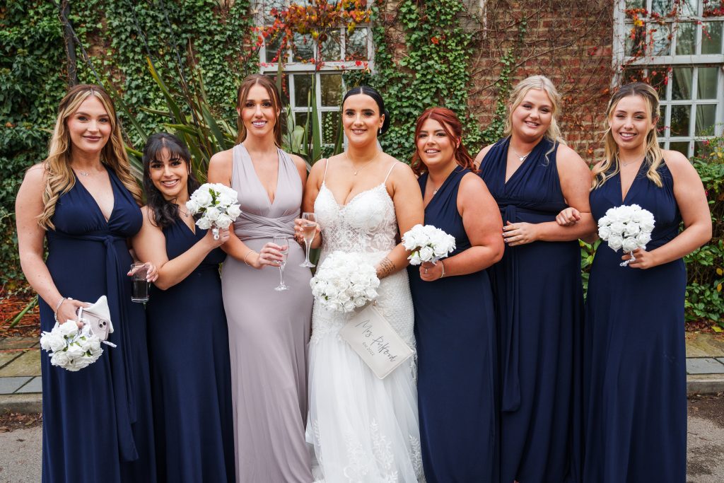 formal bridal party portrait outside lazaat hotel east yorkshire wedding scaled