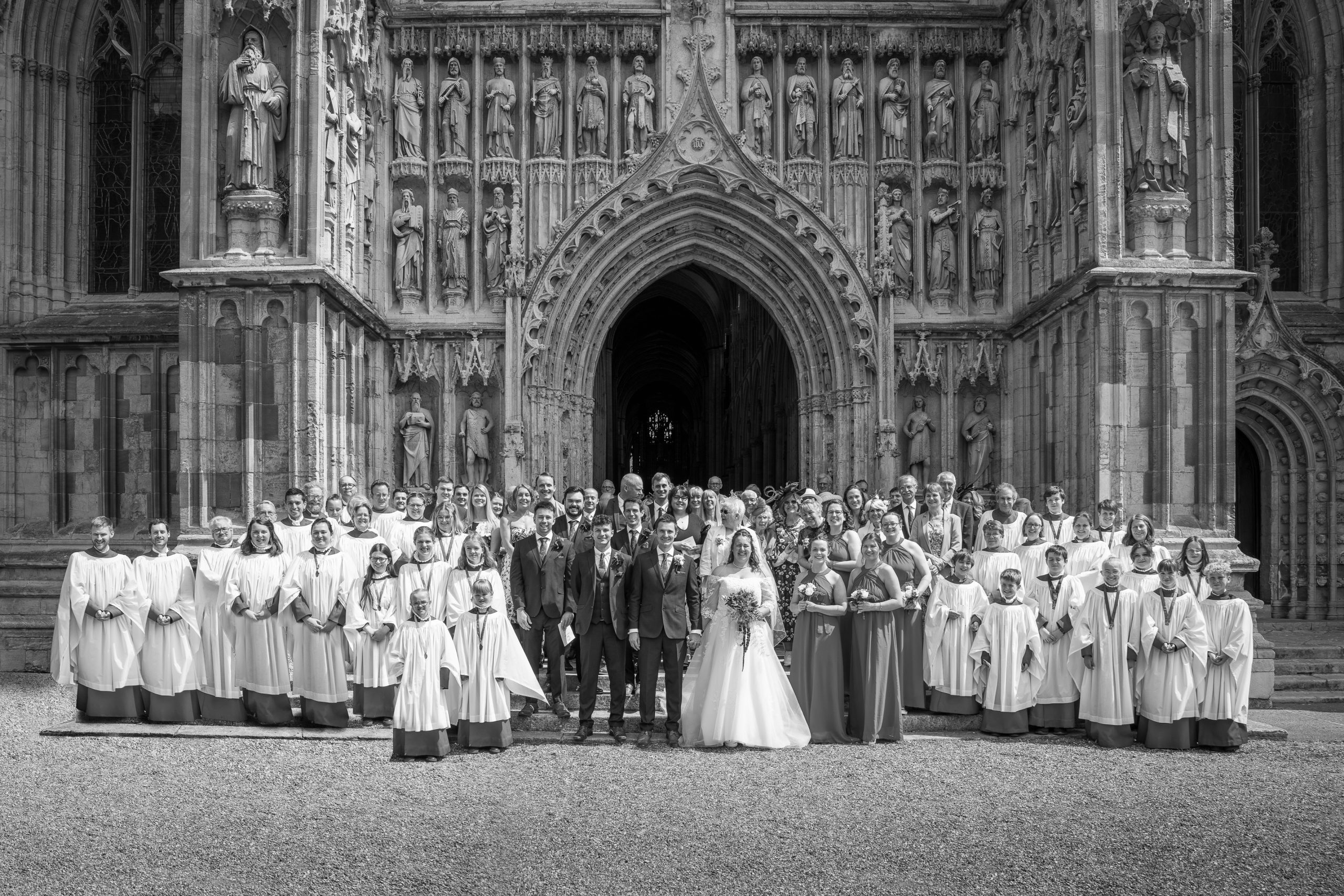 formal group portrait of wedding guests outside of beverley minster near hull scaled
