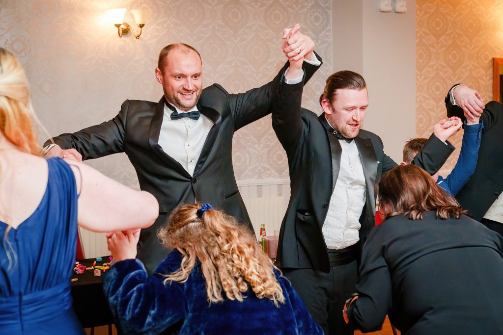 two men dancing at wedding reception minerva masonic lodge scaled
