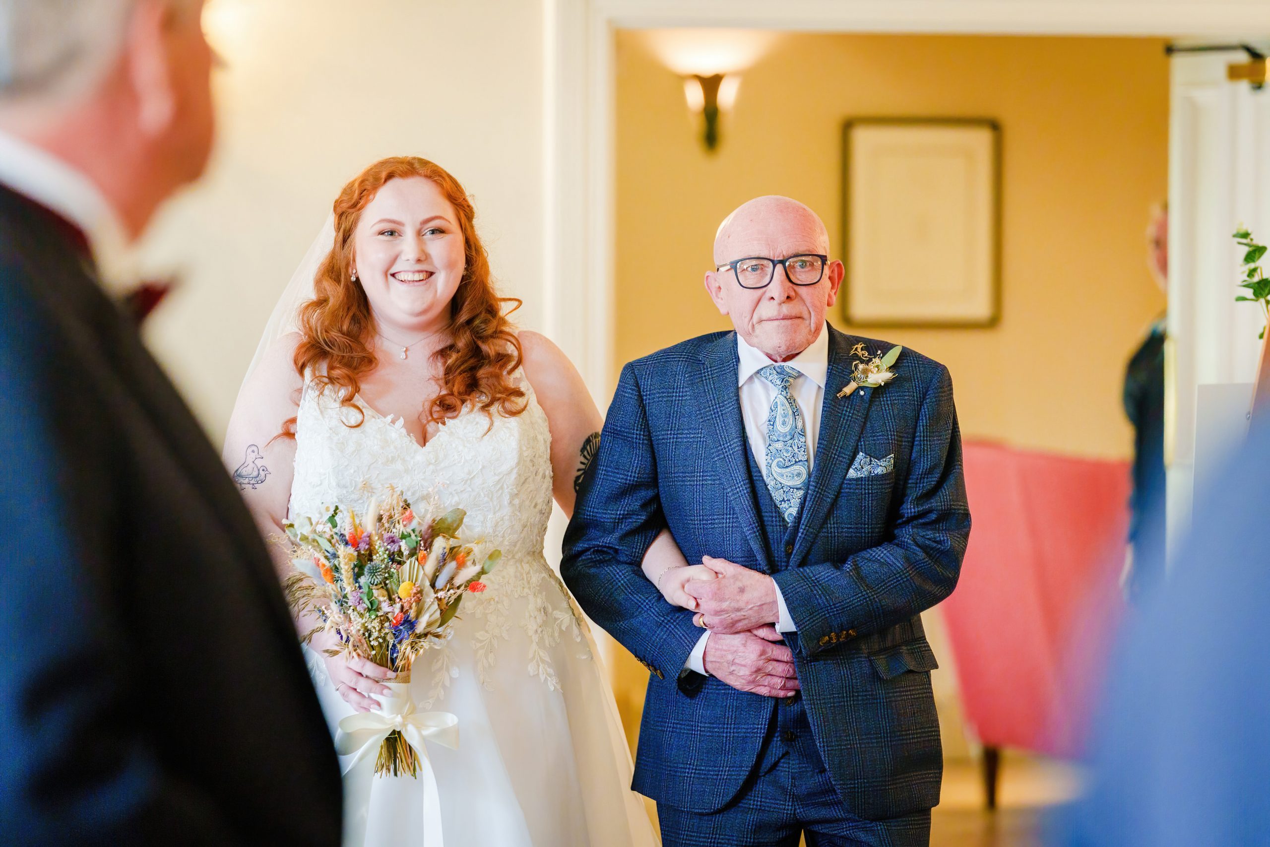bride walking down the aisle at a tickton grange wedding