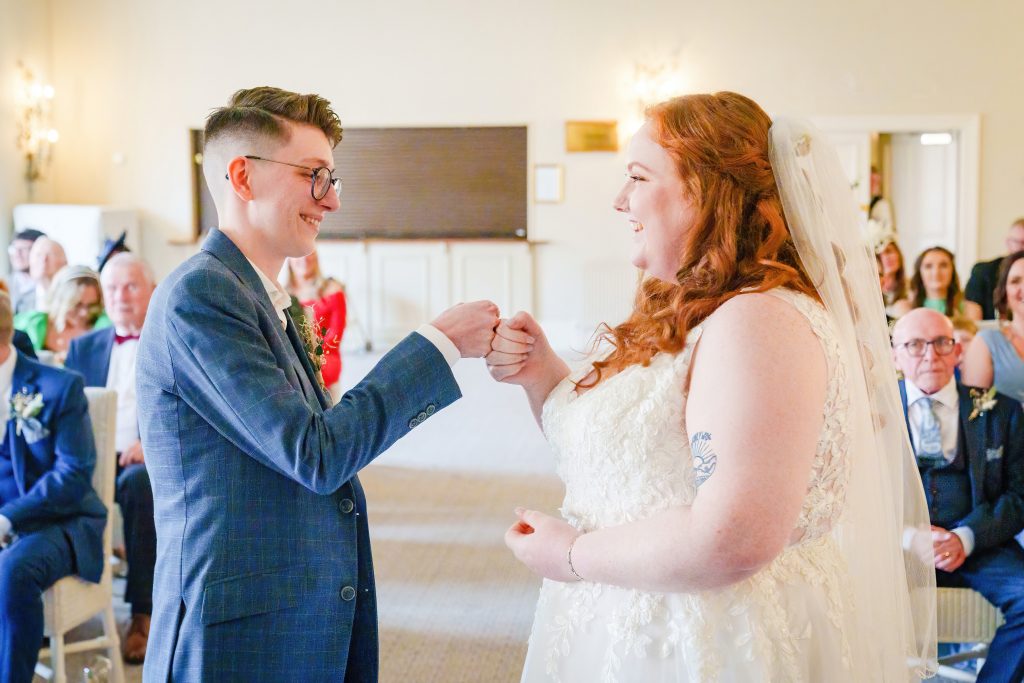 fist bump after a wedding ceremony