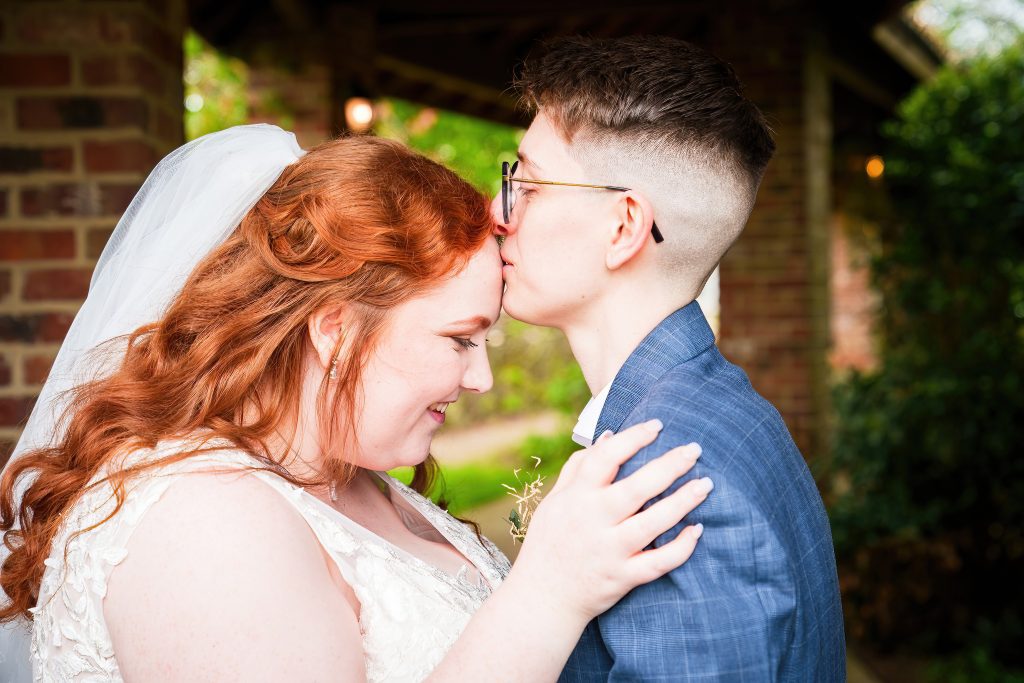 two brides kiss at their tickton grange wedding